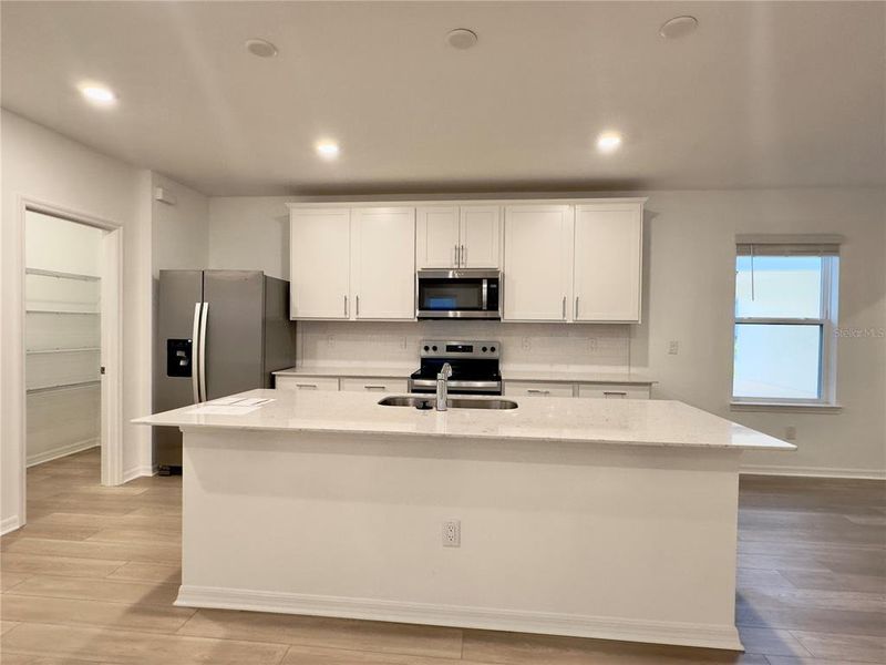 Furnished interior view inside a new home in Parkside Trails, Clermont (Image 6).