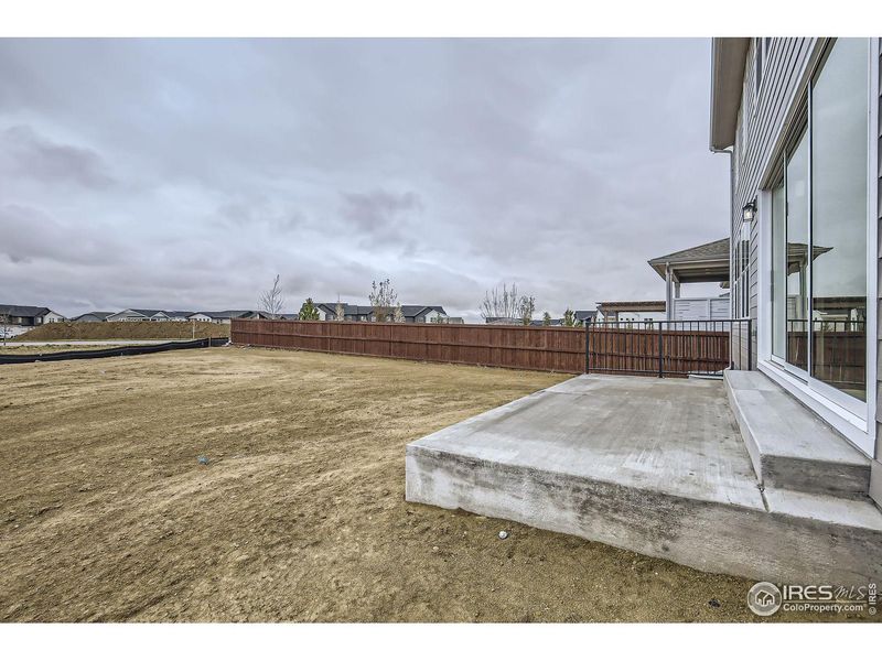 Exterior details and patio area of a home in RainDance, Windsor (Image 26).