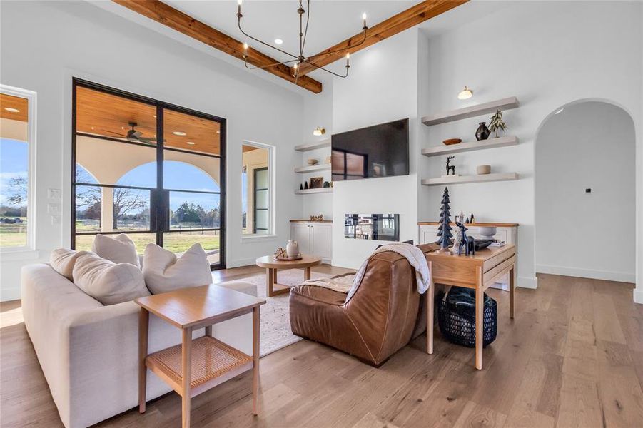 Living room with vaulted 14 ft ceilings and beams