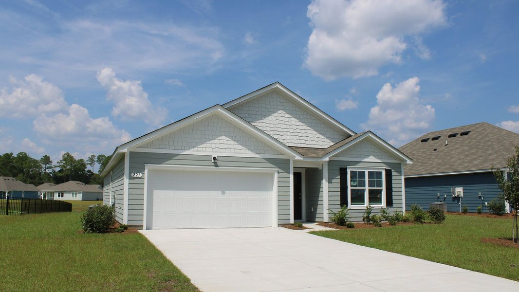Front exterior of a new home in Kingston Bay, Conway, SC, highlighting curb appeal (Image 2). Front exterior of a new home in Kingston Bay, Conway, SC, highlighting curb appeal (Image 2).