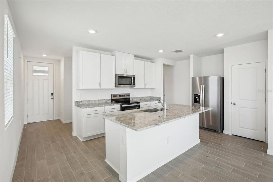 Furnished interior view inside a new home in Benton Hills - Classic Series, Brooksville (Image 10). Furnished interior view inside a new home in Benton Hills - Classic Series, Brooksville (Image 10).