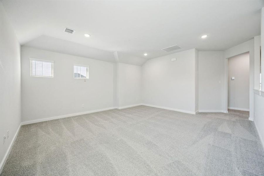 Game room in the Masters home plan by Trophy Signature Homes – REPRESENTATIVE PHOTO