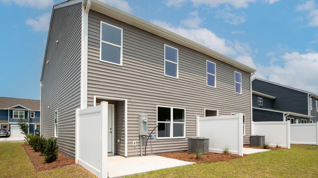 Exterior details and patio area of a home in Townes at Seabrooke, Leland (Image 2). Exterior details and patio area of a home in Townes at Seabrooke, Leland (Image 2).