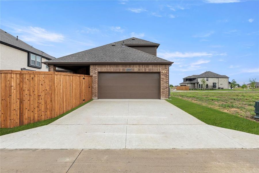 Front exterior of a new home in Villages of Creekwood, Frisco, TX, highlighting curb appeal (Image 18). Front exterior of a new home in Villages of Creekwood, Frisco, TX, highlighting curb appeal (Image 18).