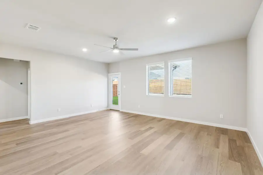 Living Room in the Haylee home plan by Trophy Signature Homes - REPRESENTATIVE PHOTO
