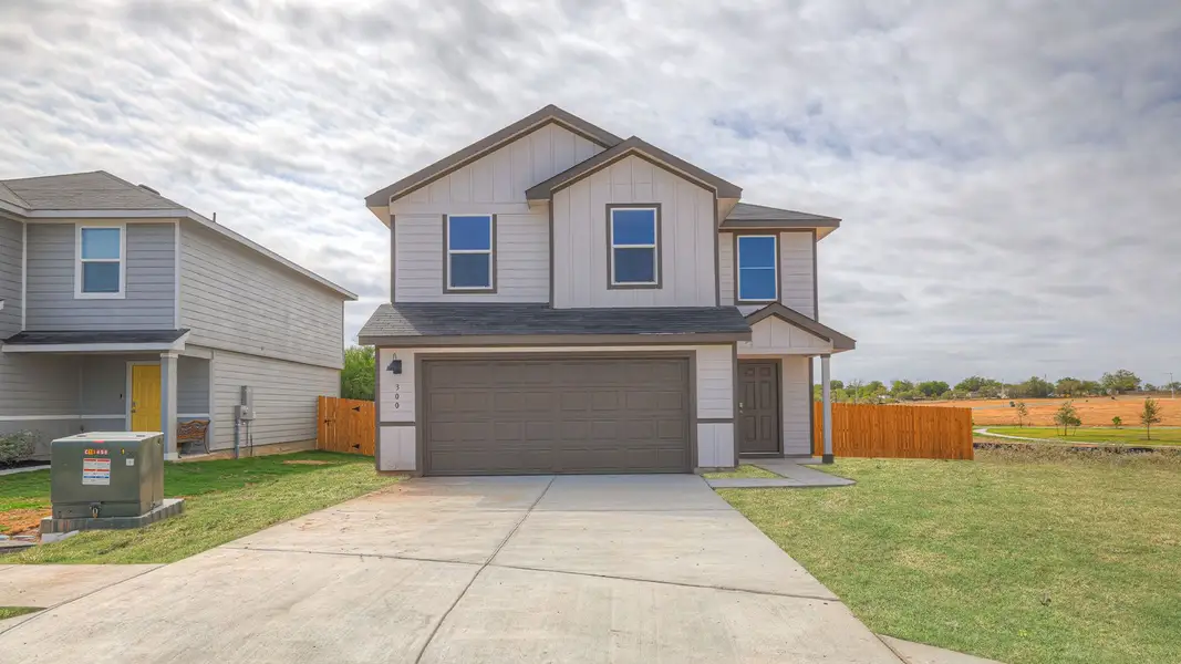 Front exterior of a new home in Ladera, Luling, TX, highlighting curb appeal (Image 1). Front exterior of a new home in Ladera, Luling, TX, highlighting curb appeal (Image 1).