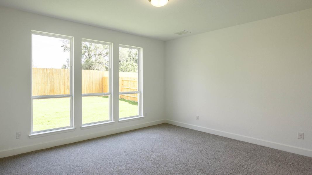 Empty room with baseboards and carpet floors Empty room with baseboards and carpet floors
