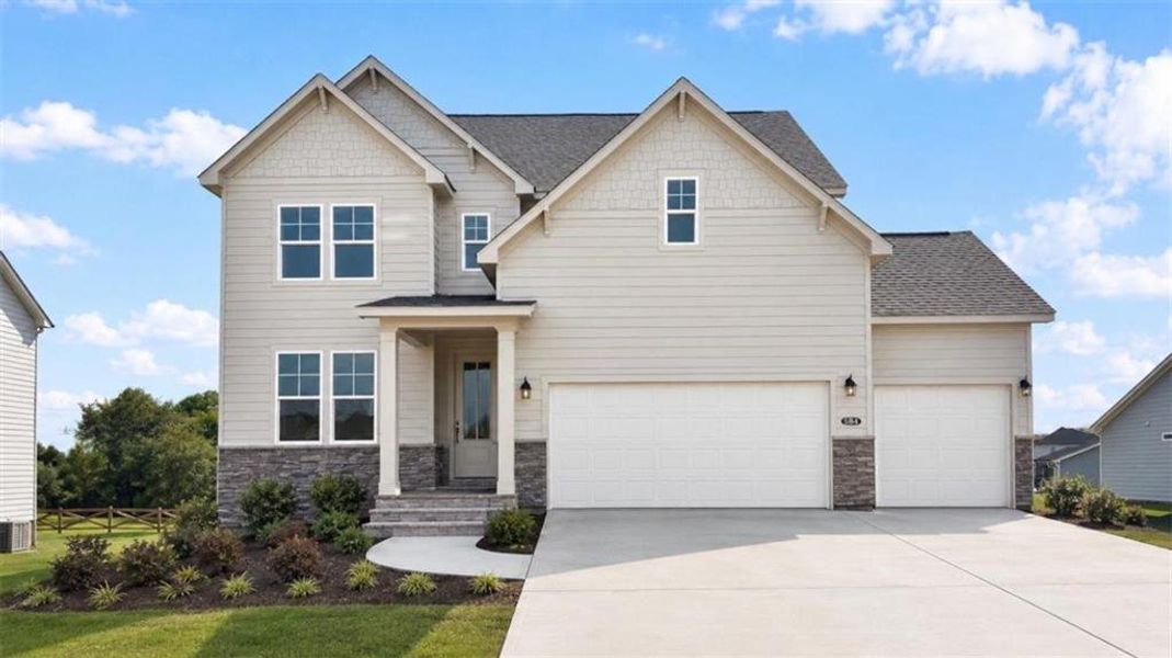 Front exterior of a new home in Wehunt Meadows, Hoschton, GA, highlighting curb appeal (Image 1). Front exterior of a new home in Wehunt Meadows, Hoschton, GA, highlighting curb appeal (Image 1).