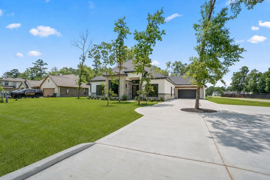 This extra long driveway is U shaped with 2 entry points and can accommodate 10+ vehicles. This extra long driveway is U shaped with 2 entry points and can accommodate 10+ vehicles.