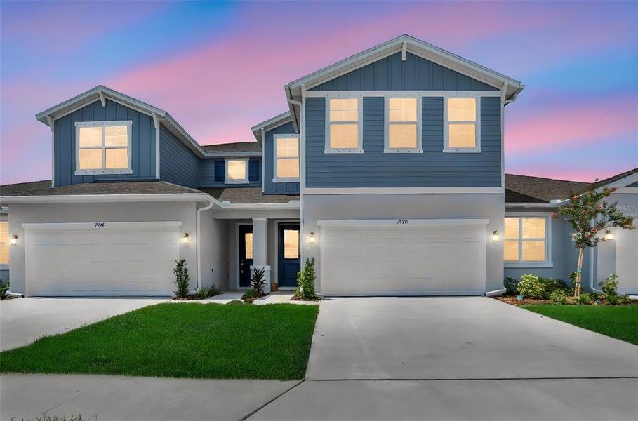 Front exterior of a new home in Seaire, Parrish, FL, highlighting curb appeal (Image 21).