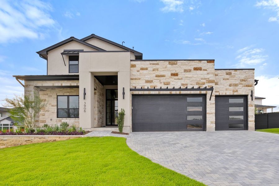 Front exterior of a new home in Milky Way at River Place, Austin, TX, highlighting curb appeal (Image 1).