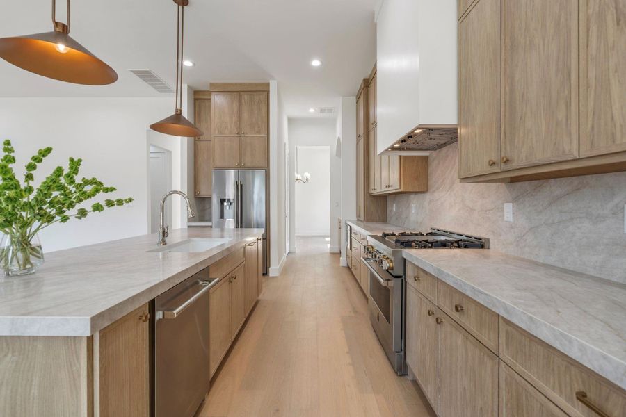 Taj mahal countertops and JenAir appliances.