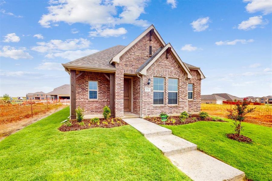 Front exterior of a new home in Lilybrooke at Legacy Hills, Celina, TX, highlighting curb appeal (Image 22). Front exterior of a new home in Lilybrooke at Legacy Hills, Celina, TX, highlighting curb appeal (Image 22).