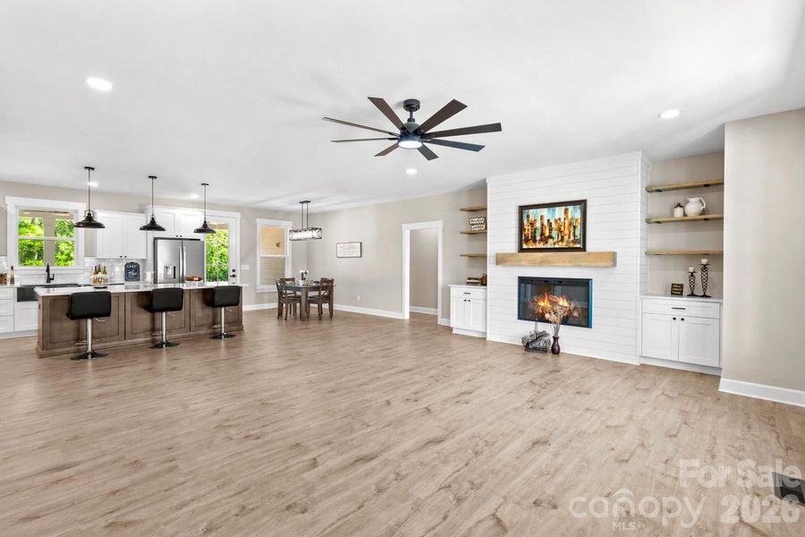 Den wthout virtual staging. Comes with the built ins and electric fireplace.