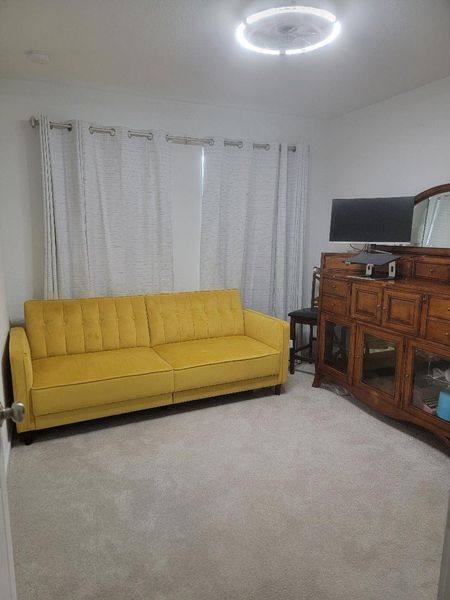 Guest Bedroom three Mustard futon couch that opens into a full bed. Wood 5-drawer dresser. Guest Bedroom three Mustard futon couch that opens into a full bed. Wood 5-drawer dresser.