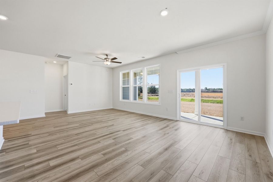 Unfurnished living room featuring light wood-style floors, recessed lighting, and ceiling fan