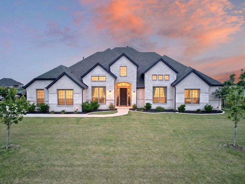 Front exterior of a new home in Heritage, McLendon-Chisholm, TX, highlighting curb appeal (Image 2). Front exterior of a new home in Heritage, McLendon-Chisholm, TX, highlighting curb appeal (Image 2).