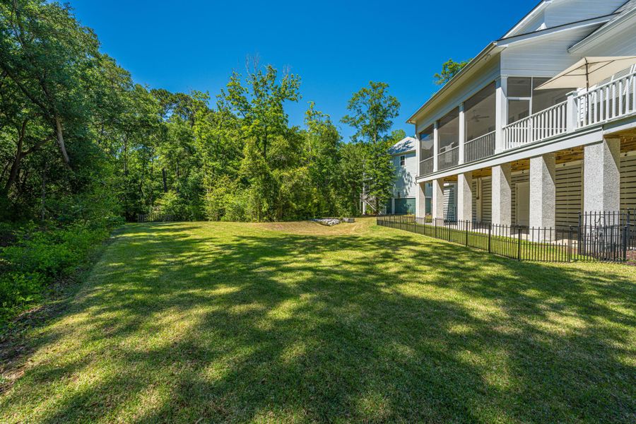 Exterior details and patio area of a home in Overlook at Copahee Sound, Awendaw (Image 27).