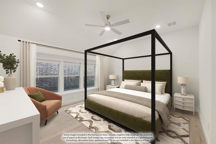 Bedroom with black four-poster bed, vaulted ceiling, ceiling fan, and light wood floors