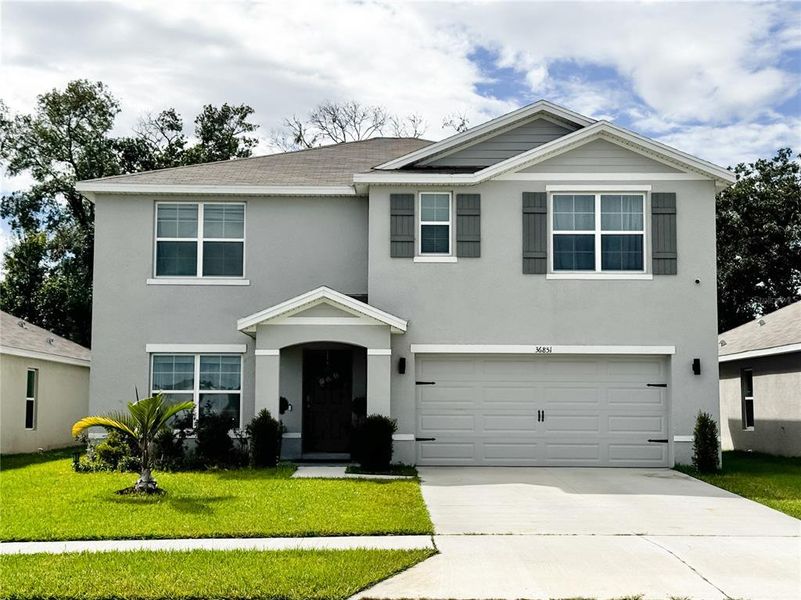 Front exterior of a new home in , Zephyrhills, FL, highlighting curb appeal (Image 2).