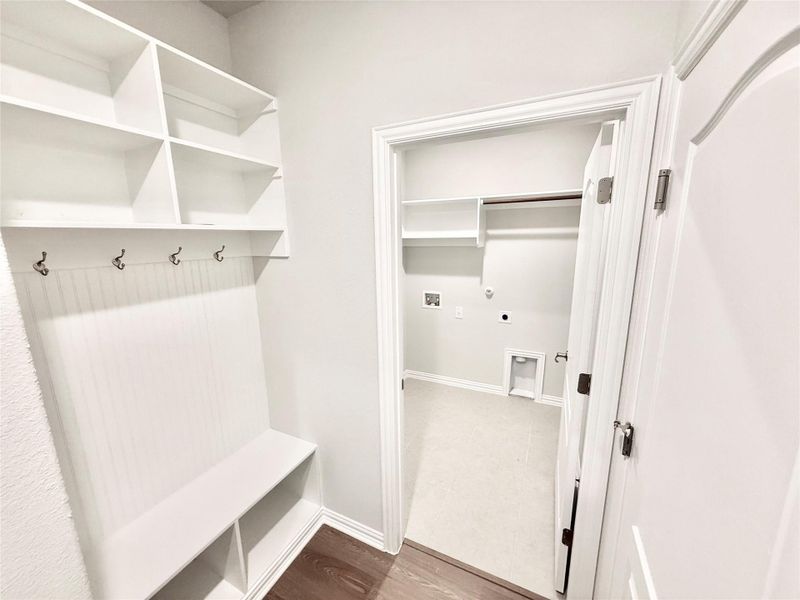 Mudroom featuring light wood finished floors and baseboards Mudroom featuring light wood finished floors and baseboards