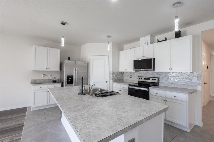 Furnished interior view inside a new home in Poinciana Enclave, Kissimmee (Image 14).