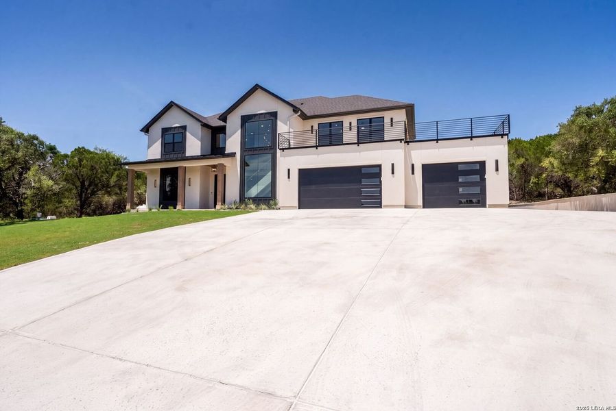 Front exterior of a new home in , Boerne, TX, highlighting curb appeal (Image 27).