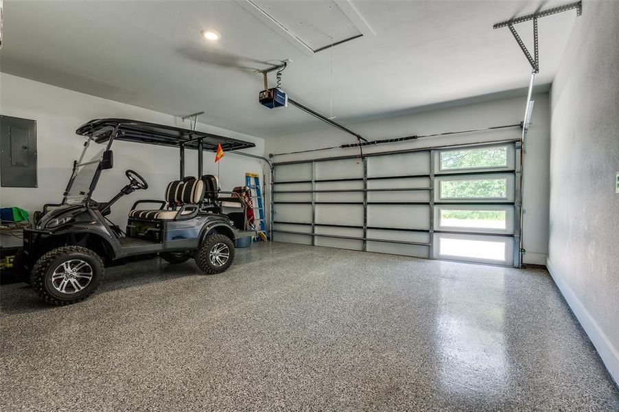 Garage with electric door opener and epoxy floors. Garage with electric door opener and epoxy floors.