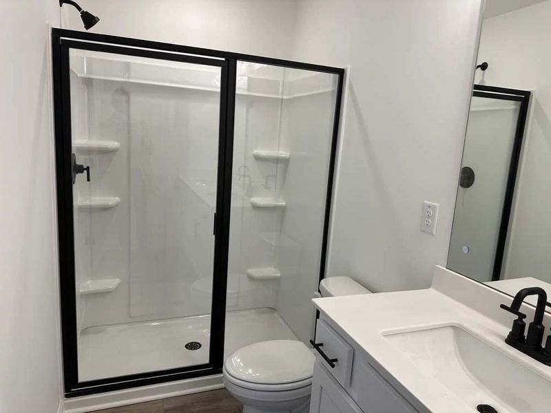 Primary Bathroom Walk-In Shower featuring Rockwell Collection Finishes