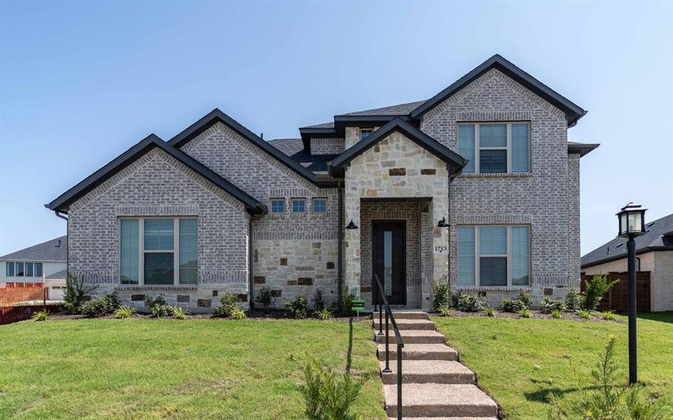 Front exterior of a new home in Solterra, Mesquite, TX, highlighting curb appeal (Image 1). Front exterior of a new home in Solterra, Mesquite, TX, highlighting curb appeal (Image 1).