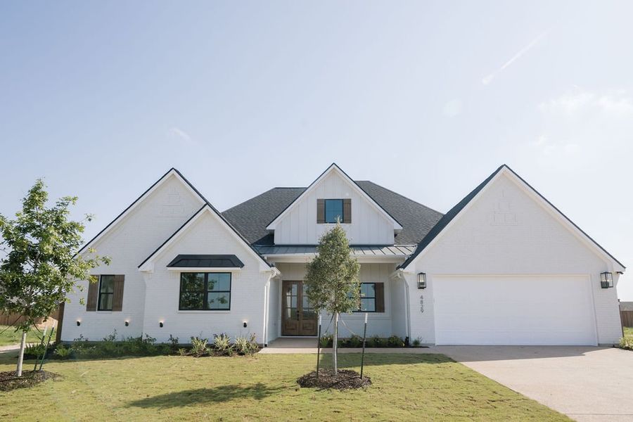 Representative exterior photo of a completed home built from the The Sophie by Reece Homes in Harvest Meadows, Bryan, TX (Image 22). Representative exterior photo of a completed home built from the The Sophie by Reece Homes in Harvest Meadows, Bryan, TX (Image 22).