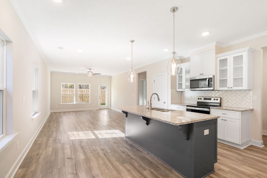 The 1313 Plan Kitchen & Living Room | Functional & Maximized Space designed by Ivey Homes