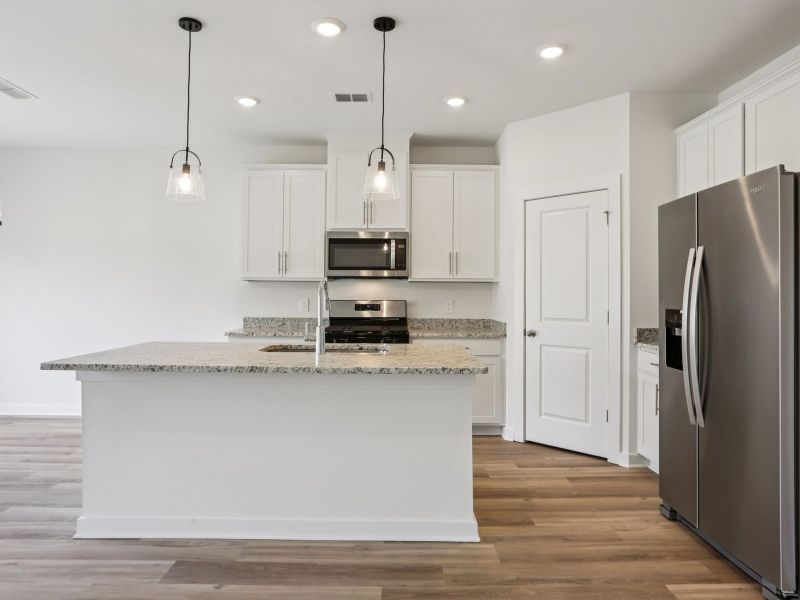 Prep dinner in the kitchen without missing the conversation in the great room.