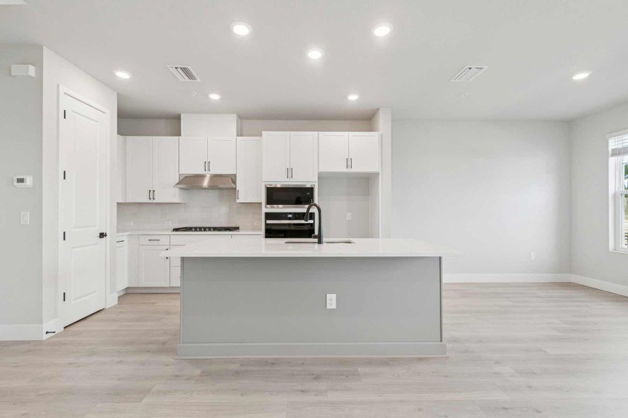 Representative furnished interior of a home built from the The Seawater by David Weekley Homes in Persimmon Place - Townhomes, Wesley Chapel (Image 5).