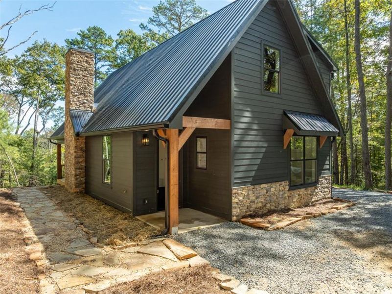 Exterior details and patio area of a home in , Ellijay (Image 31).