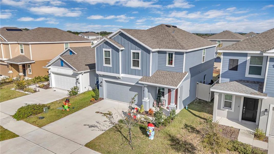 Front exterior of a new home in Peace Creek Reserve: Legacy Collection, Winter Haven, FL, highlighting curb appeal (Image 21). Front exterior of a new home in Peace Creek Reserve: Legacy Collection, Winter Haven, FL, highlighting curb appeal (Image 21).