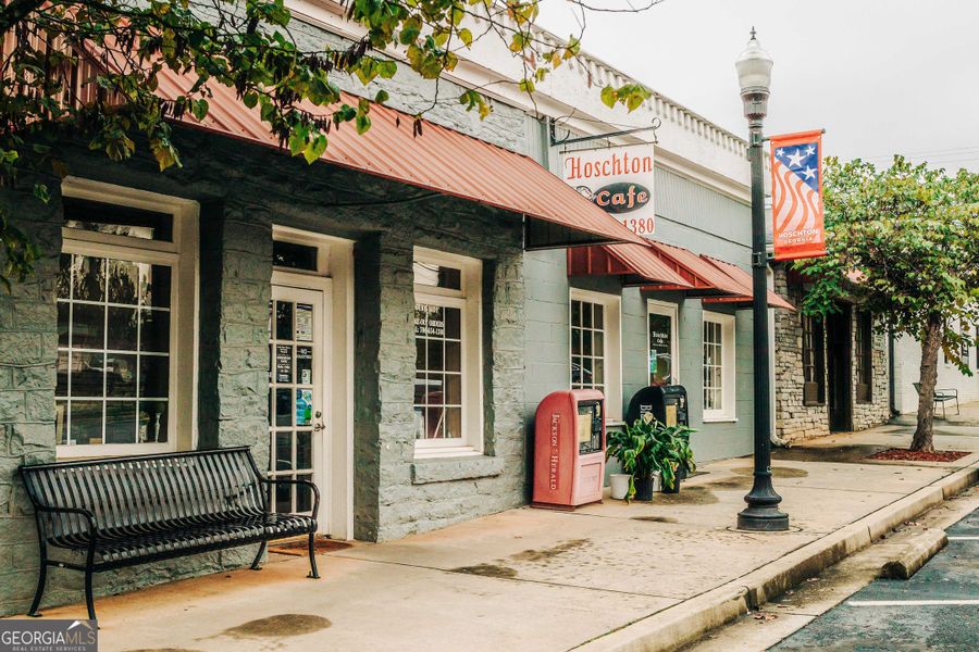 Front exterior of a new home in Rosewood Lake Estates, Hoschton, GA, highlighting curb appeal (Image 25).