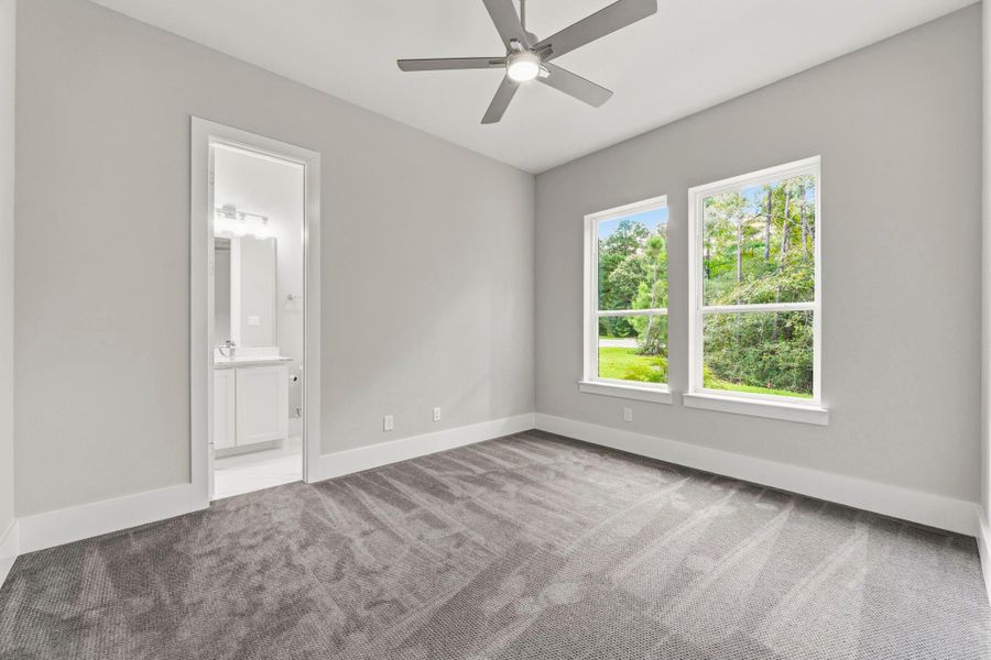 Double windows add natural light in secondary bedroom.