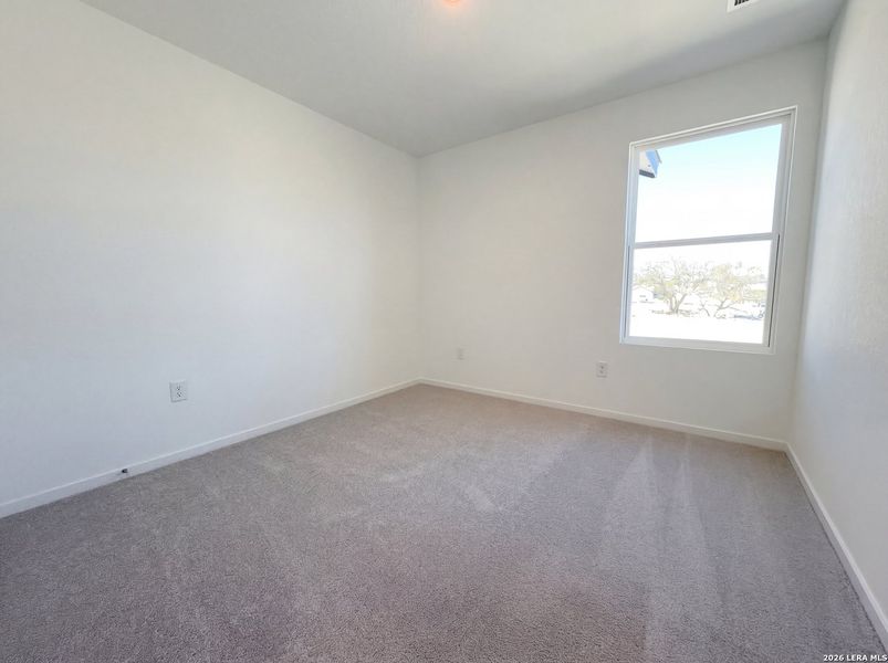 Spacious, unfurnished interior of a new home in Hunters Ranch, San Antonio (Image 13).