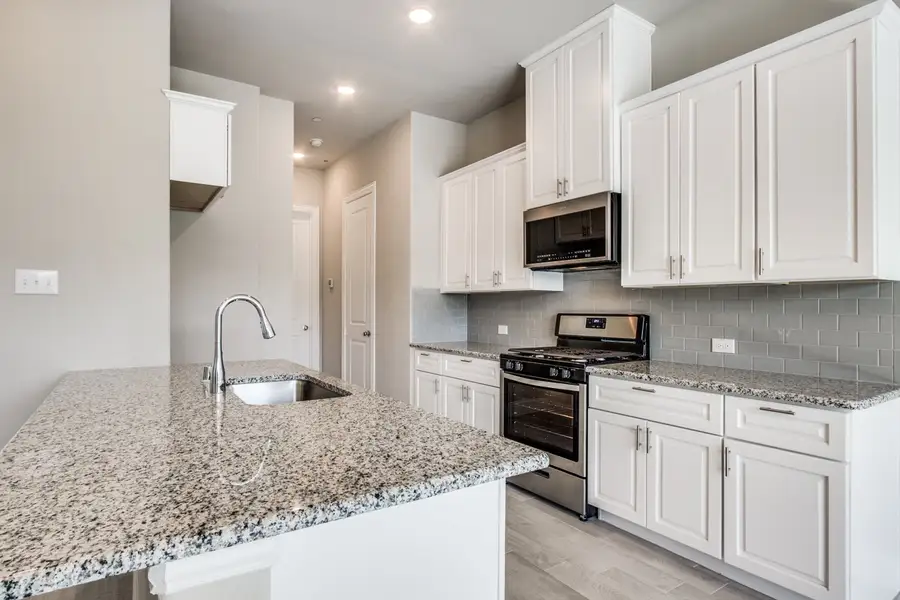 Image 2 representing the Carter by Megatel Homes in Manors at Woodbridge, Wylie, TX. Image 2 representing the Carter by Megatel Homes in Manors at Woodbridge, Wylie, TX.