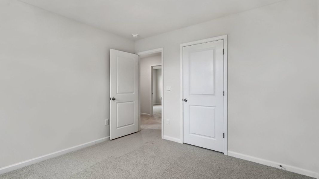 Representative unfurnished interior of a home built from the Robie by D.R. Horton in The Grove at Matthews Landing, Fuquay Varina (Image 28).