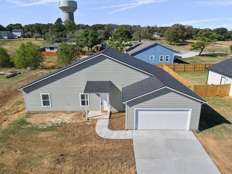 Front exterior of a new home in , Kennedale, TX, highlighting curb appeal (Image 1).