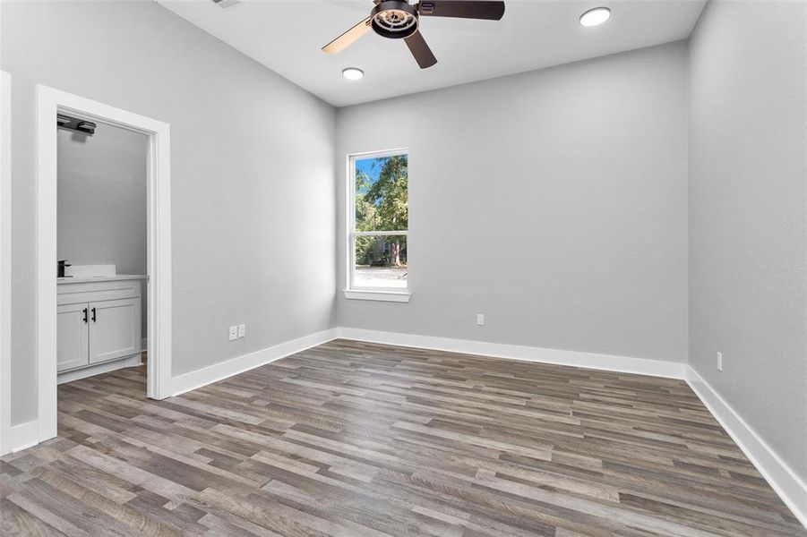 Bedroom #3 located on the side of home. Featuring a private, full bath.