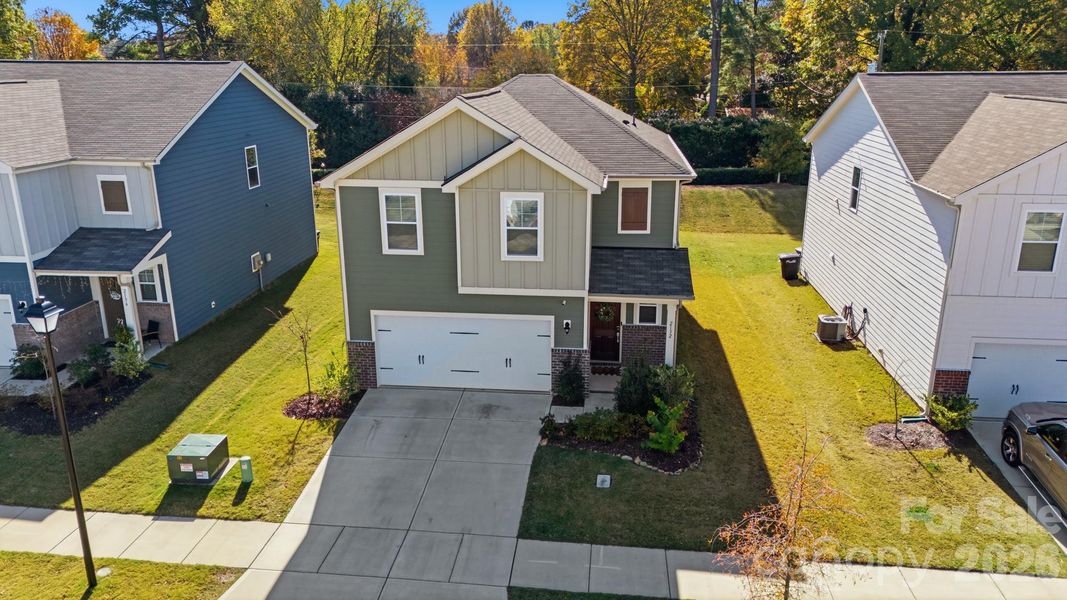 Front exterior of a new home in , Monroe, NC, highlighting curb appeal (Image 26).