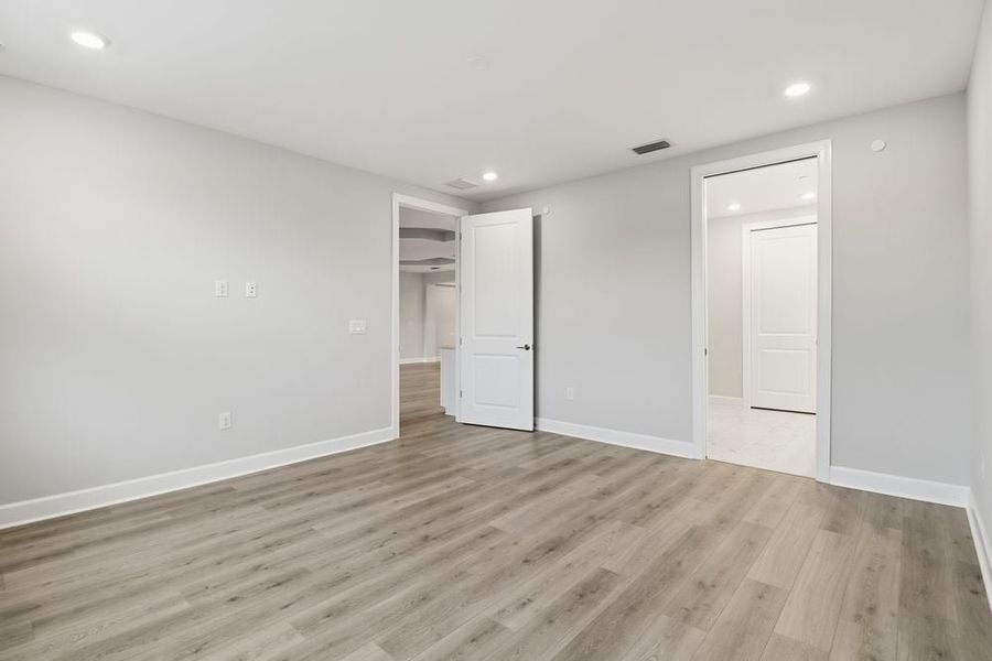 Spacious, unfurnished interior of a new home in Esplanade by the Islands Coach Homes, Naples (Image 13).