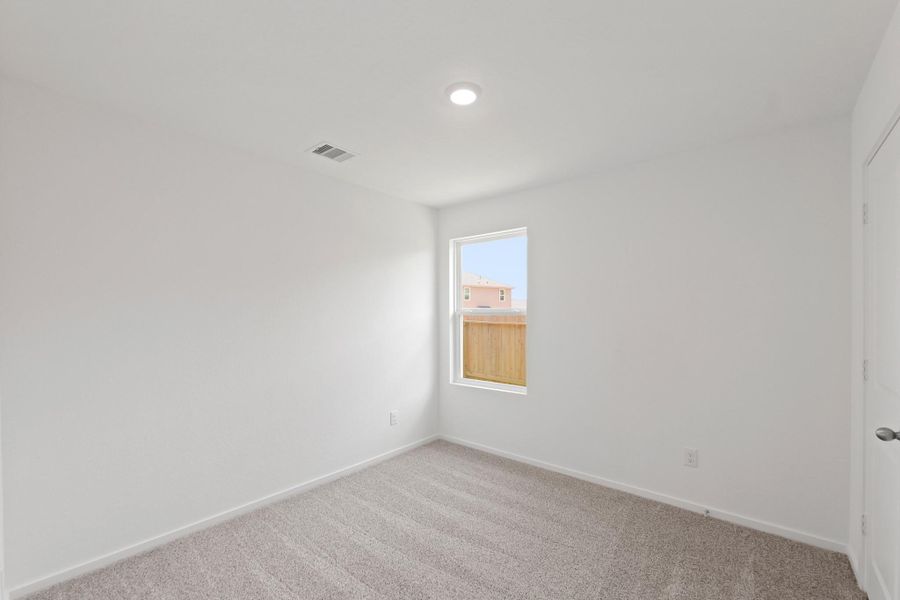 Spacious, unfurnished interior of a new home in The Canopies, Splendora (Image 12).