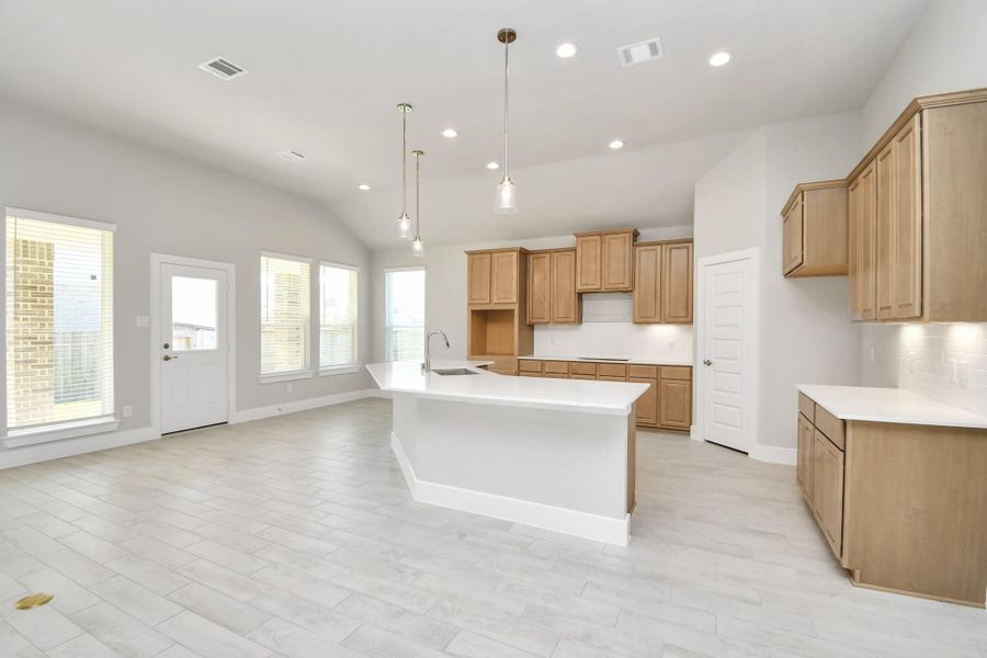 The kitchen is a culinary haven, featuring granite countertops, a tile backsplash, stainless steel appliances, 42” upper cabinets, and undercabinet lighting. The kitchen is a culinary haven, featuring granite countertops, a tile backsplash, stainless steel appliances, 42” upper cabinets, and undercabinet lighting.