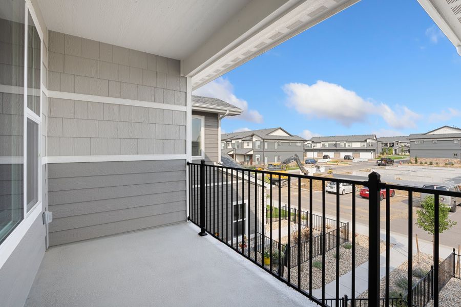 Exterior details and patio area of a home in The Lakes at Centerra, Loveland (Image 3).
