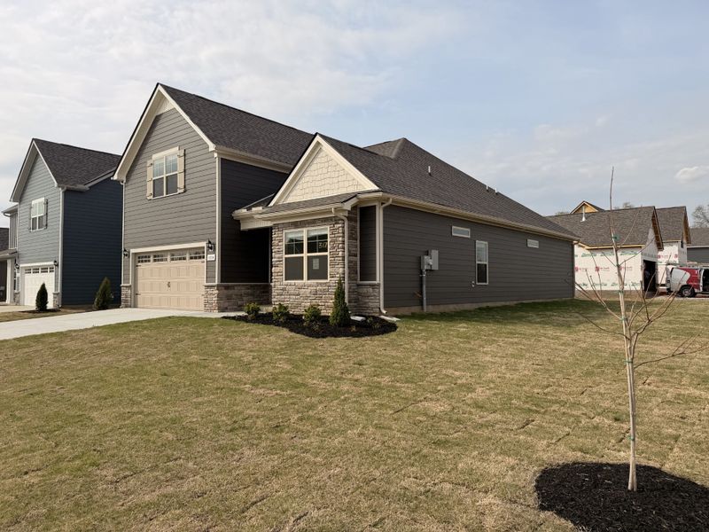 Showcasing this stunning new home on its corner lot!