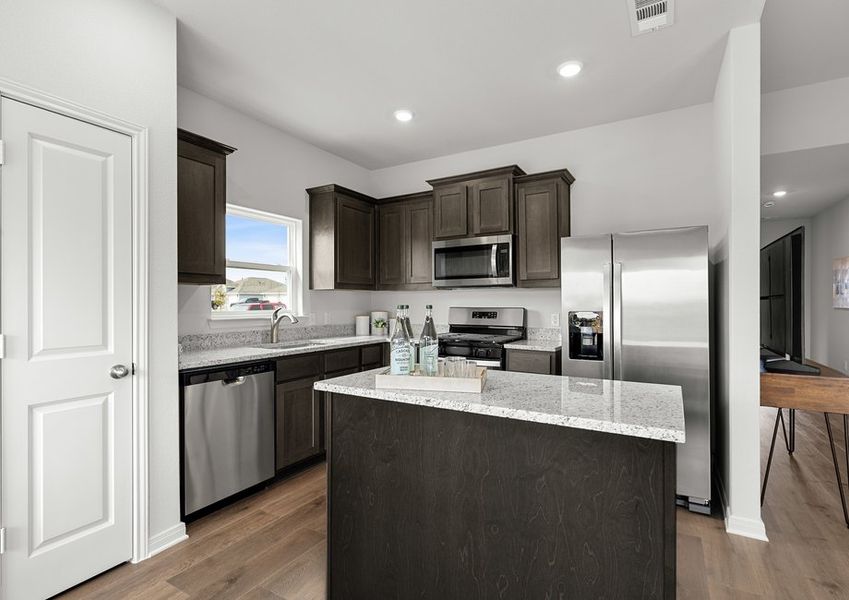 The kitchen has a convenient island. The kitchen has a convenient island.